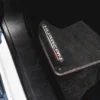 Black car floor mat installed