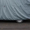 Close-up of a car top cover with tie-down strap