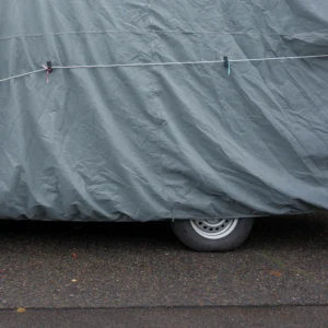 Close-up of a car top cover with tie-down strap
