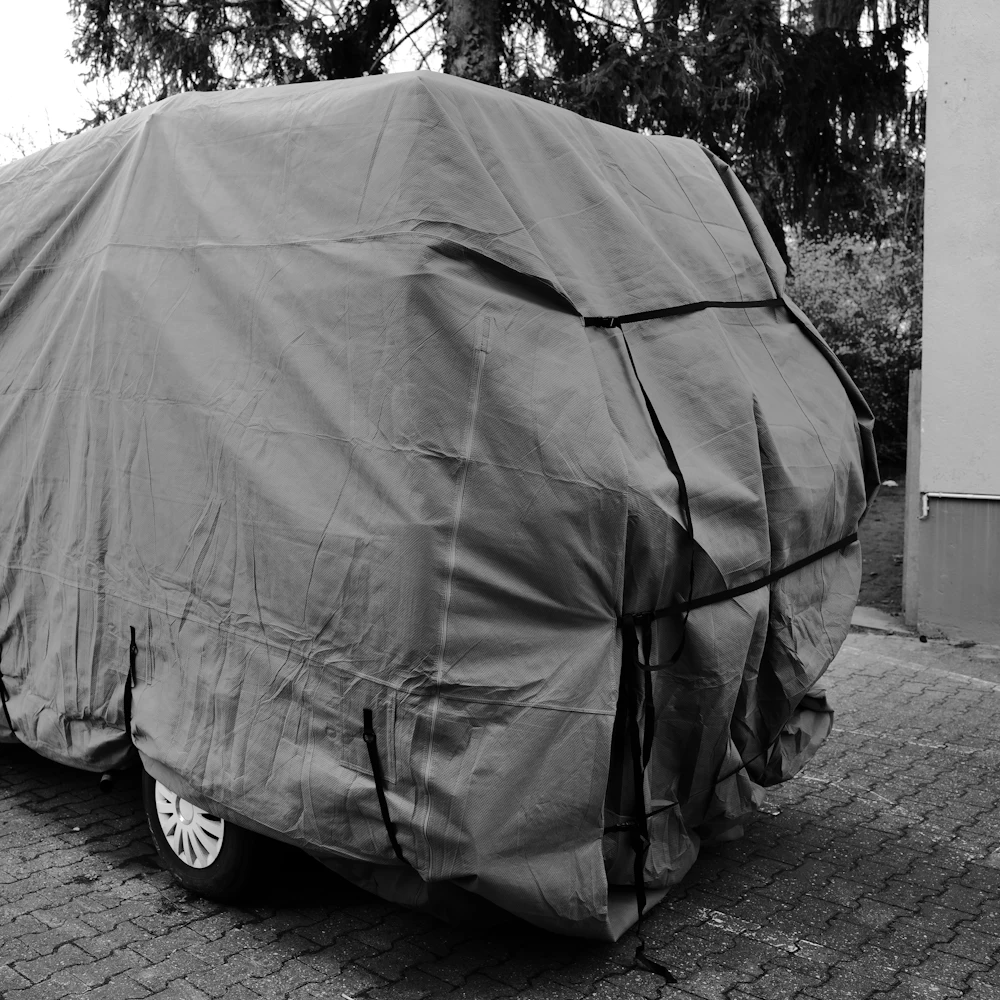 top-cover-suv-grey SUV protected with a grey waterproof top cover